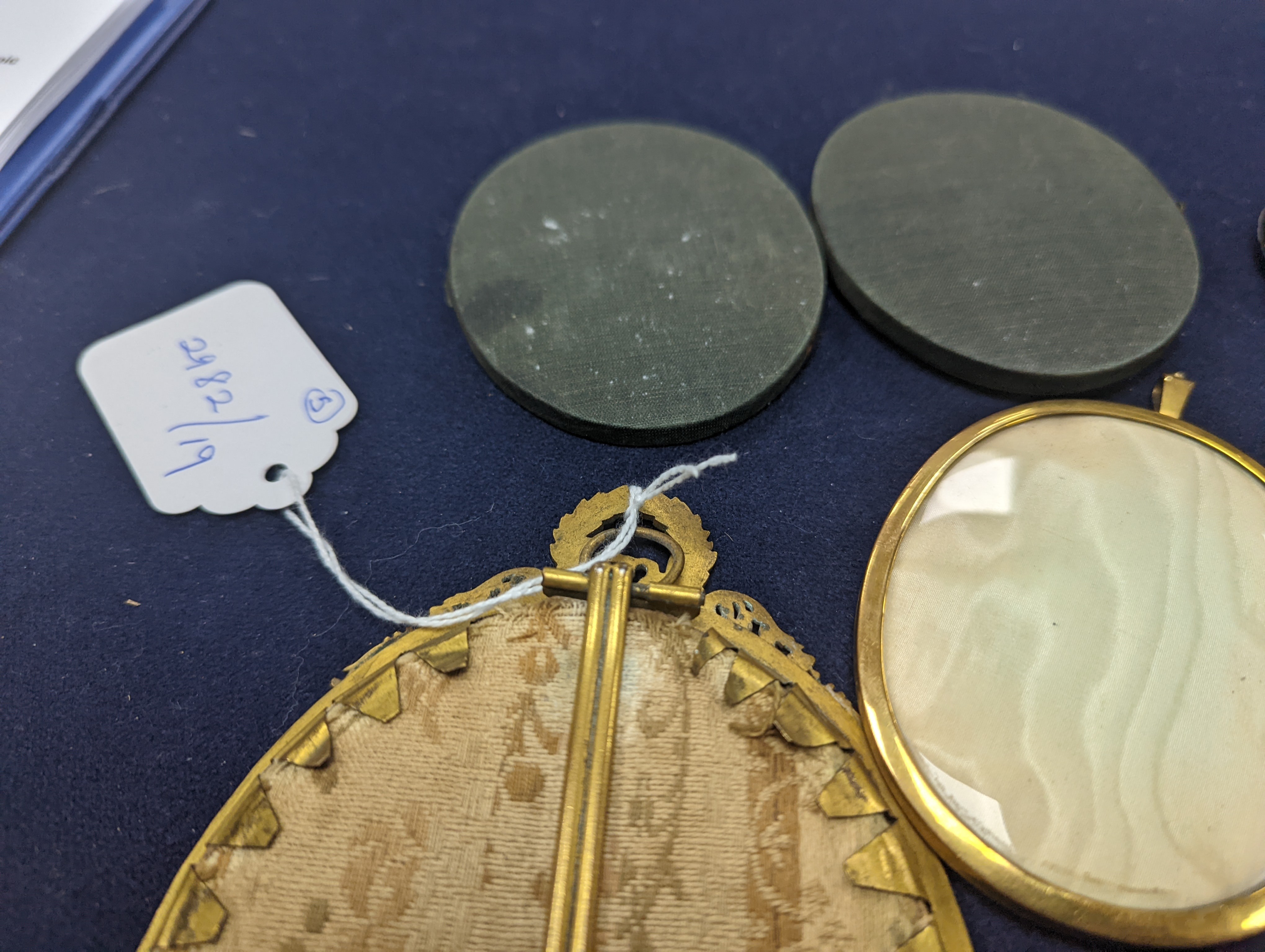 A paste and enamel framed Portrait miniature on ivory, 9.2cm and four other portrait miniatures (three on ivory)